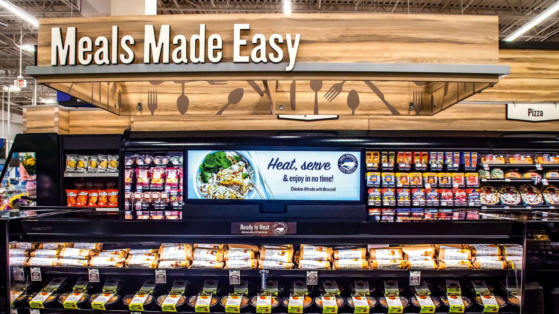 A shot of a big stand of food in a supermarket